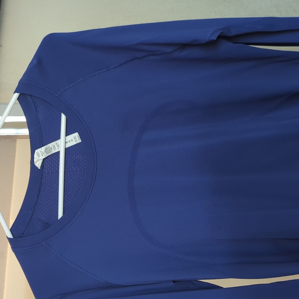 Long sleeve swiftly shirt, waist length, size 14